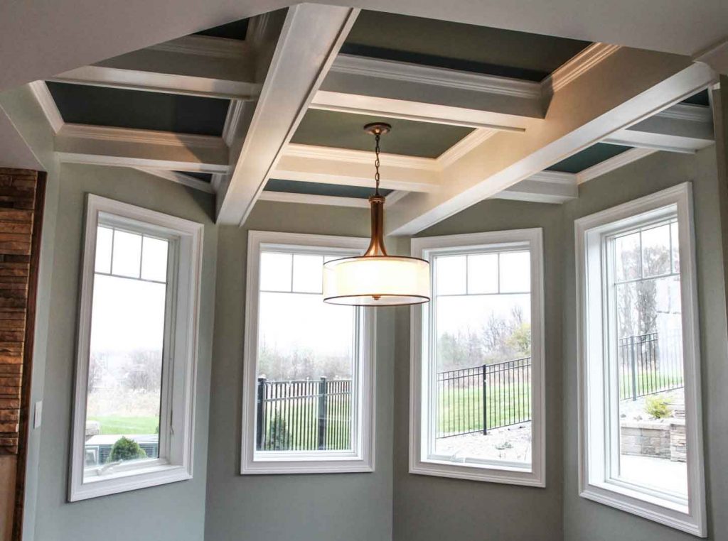 Large windows and new decorative light fixture installed in walk-out basement