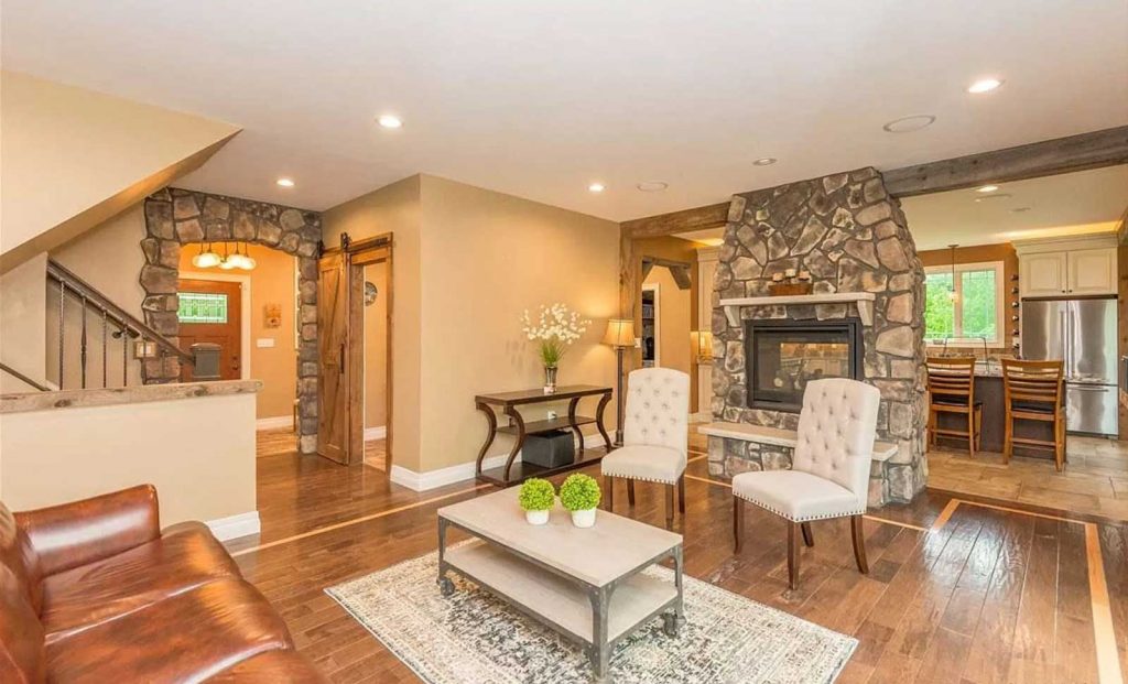 Living room with stone fireplace